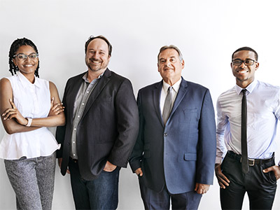 Diverse group of business professionals smiling at camera. 